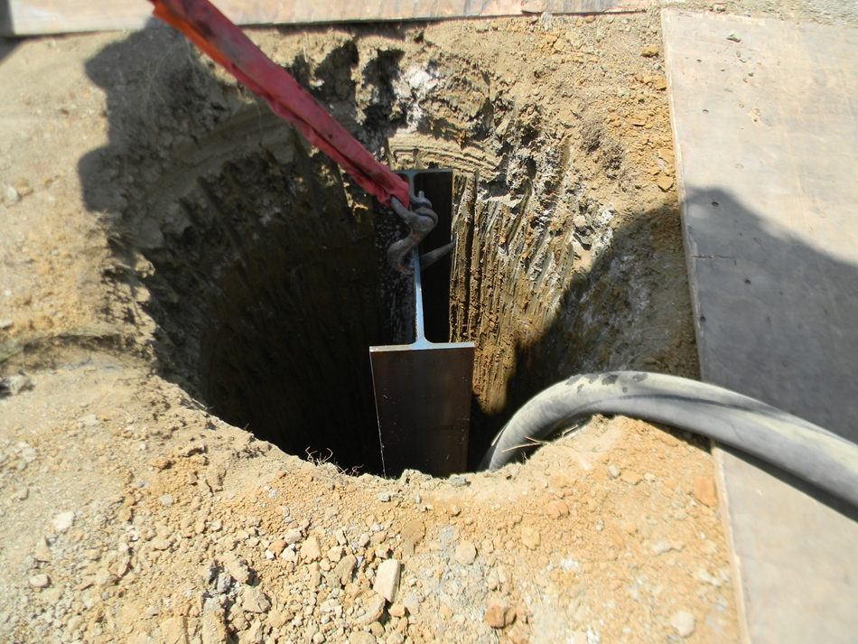Pier holes are filled with concrete